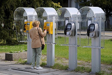 A woman calling, phoneboxes, Swinoujscie, Poland, Europe