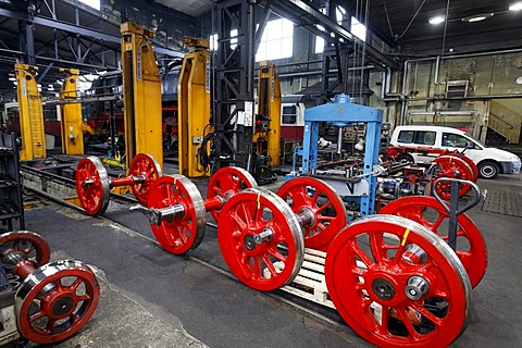 Wheel axles of a historic steam locomotive in the workshop building, depot of the HSB, Harzer Schmalspurbahnen narrow-gauge railway, Wernigerode, Harz, Saxony-Anhalt, Germany, Europe