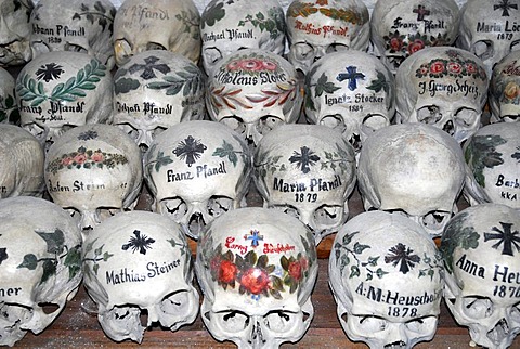 Painted skulls at the churchyard bone house, Catholic church, Hallstatt at the Hallstaetter See, Lake Hallstatt, UNESCO World Heritage Site, Salzkammergut, Alps, Upper Austria, Europe