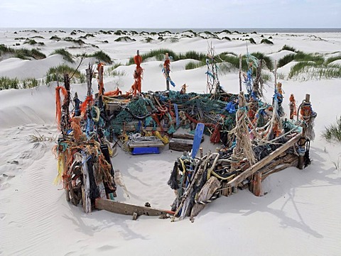 Beach castle built in sand dunes with driftwood and mmaterial washed up from the Sea between Nebel and Norddorf, Amrum Island, Schleswig-Holstein, Germany, Europe