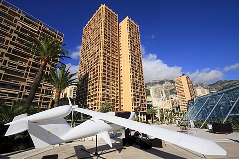 Small aircraft of the brand Visa Airplanes in front of the Grimaldi Forum, skyscrapers Columbia Palace and Houston Palace, Principality of Monaco, Cote d'Azur, Europe