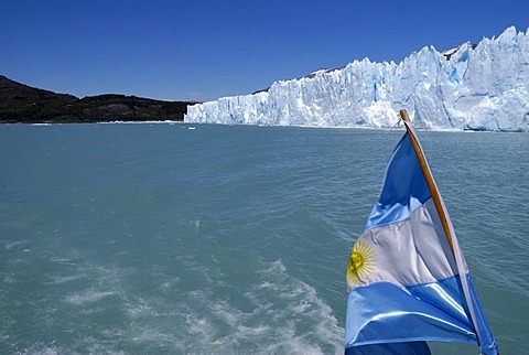 Perito Moreno Glacier, with an Argentinian flag, Patagonia, Argentina, South America