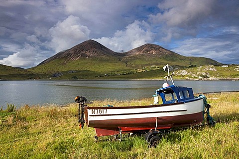 Fishing boat with mountains on the Isle of Skye, Highland Council, Scotland, United Kingdom, Europe