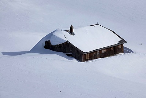 Snowy Risi mountain lodge on the Risipass in the Alpstein mountains, Swiss Eastern Alps, Switzerland, Europe