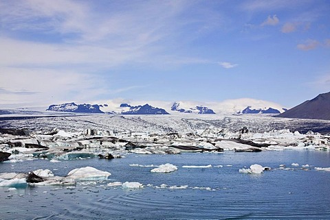 Icebergs in the Joekulsarlon glacial lake with different colorations due to volcanic ash, Joekulsarlon, Vatnajoekull, Iceland, Europe