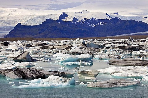 Icebergs in the Joekulsarlon glacial lake with different colorations due to volcanic ash, Joekulsarlon, Vatnajoekull, Iceland, Europe