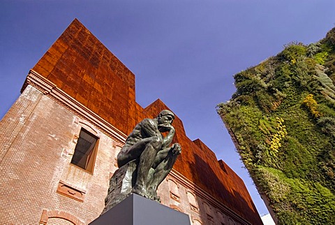 Rodin's sculpture "The Thinker" in front of the Caixa Forum Museum Art Center, Madrid, Spain, Europe