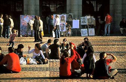 Tourists and Spaniards in the Plaza Mayor, with drawings of street artists, Madrid, Spain, Europe