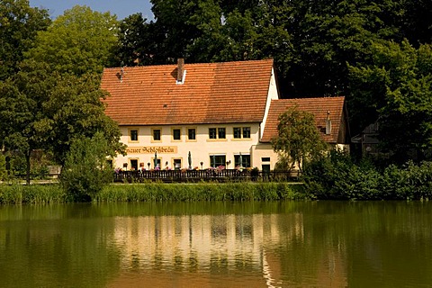 Schlossbraeu restaurant reflected in a pond, Thurnau, Franconian Switzerland, Franconia, Bavaria, Germany, Europe