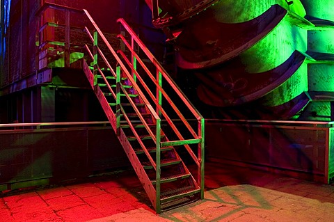 Colourfully lit staircase in the former steelworks, Landschaftspark Duisburg Nord landscape park, Ruhrgebiet area, North Rhine-Westphalia, Germany, Europe