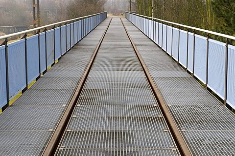 Bridge with a rails in the Landschaftspark Duisburg Nord landscape park, Ruhrgebiet area, North Rhine-Westphalia, Germany, Europe