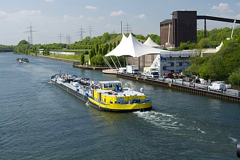 Amphitheater and cargo ship on the Rhine-Herne Canal, Nordsternpark, Route der Industriekultur Route of Industrial Heritage, Gelsenkirchen, Ruhrgebiet region, North Rhine-Westphalia, Germany, Europe