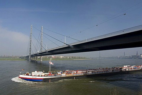 Rheinkniebruecke bridge and cargo ship, Duesseldorf, state capital of North Rhine-Westphalia, Germany, Europe