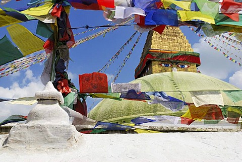 View through prayer flags on Buddhist stupa of Bodhnath, Kathmandu, Nepal, Asia