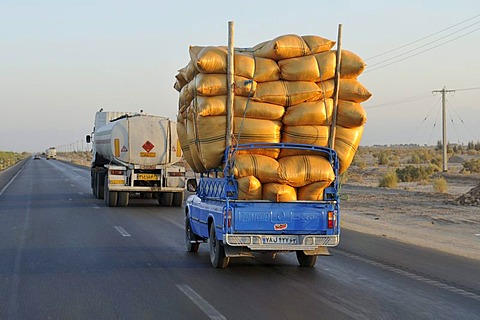 Iranian pickup truck overloaded with sacks on a highway, Iran, Persia, Asia