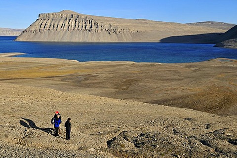 Hikers on permafrost and arctic tundra at Maxwell Bay, Devon Island, Northwest Passage, Nunavut, Canada, Arctic