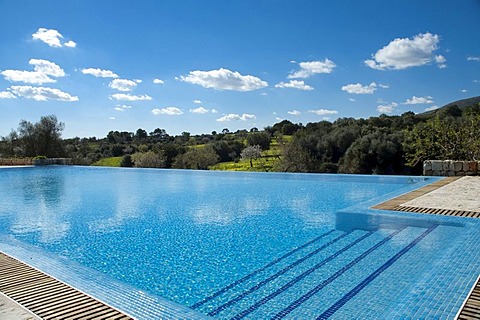 Swimming pool in a green landscape, Finca Son Mas, near Porto Cristo, Majorca, Balearic Islands, Spain, Europe