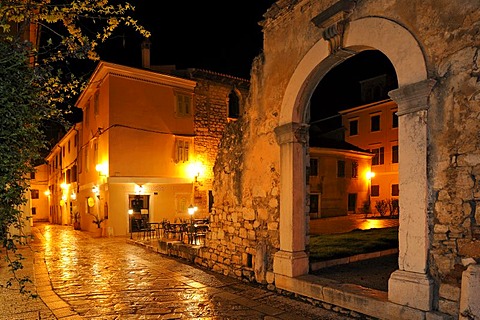 Decumanus at night in Porec, Croatia, Europe