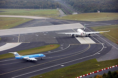 Duesseldorf International Airport, Emirates Airbus A330 on the taxiway to the runway, followed by KLM Cityhopper Fokker 70, Duesseldorf, North Rhine-Westphalia, Germany, Europe