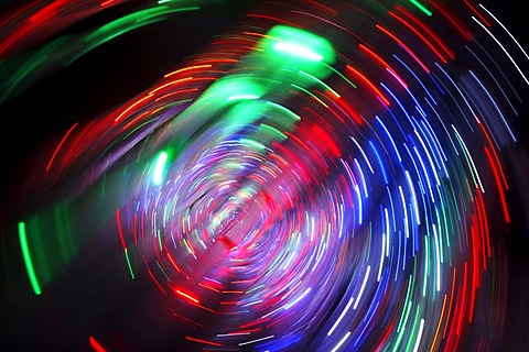 Maze, labyrinth made of colorful illuminated light rods, at a fair