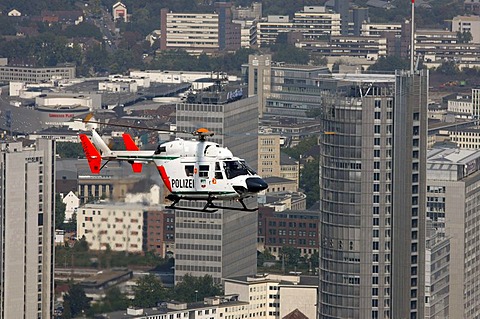 BK 117 police helicopter of the North Rhine-Westphalian police flying squadron during a mission flight, downtown Essen, North Rhine-Westphalia, Germany, Europe