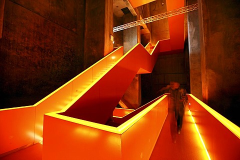 Red illuminated main staircase in the new Ruhrmuseum museum, opened in January 2010, Capital of Culture year, in the former coal washing plant of the Zeche Zollverein mine, World Heritage Site, Essen, North Rhine-Westphalia, Germany, Europe