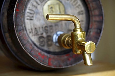 Wood beer keg in a small private brewery, with brass tap