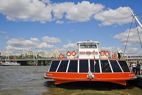 City Cruises boat on river Thames against Hungerford Bridge with the Golden Jubilee Walkways, view from river Thames, City of Westminster, England, United Kingdom, Europe