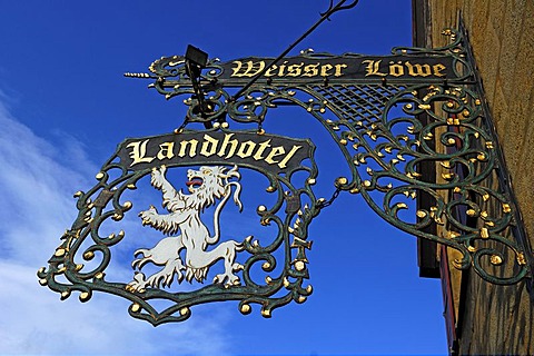 Inn sign "Weisser Loewe" against blue sky, Herrengasse 5, Eckental, Middle Franconia, Bavaria, Germany, Europe