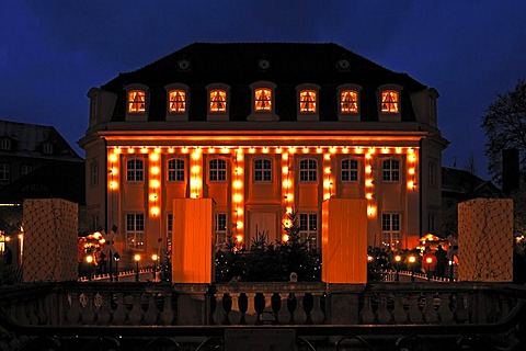 Castle, 17th century, with evening Christmas lights, in front fountain figures protected from the cold, Goethe town Bad Lauchstaedt, Saxony-Anhalt, Germany, Europe