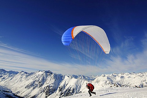 Paraglider at take-off, Pardorama Mountain, Ischgl ski resort, Tyrol, Austria, Europe