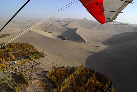 Microlight flight over the Gobi Desert, aerial view of Crescent Lake and the sand dunes in the Gobi Desert, Silk Road, Dunhuang, Gansu, China, Asia