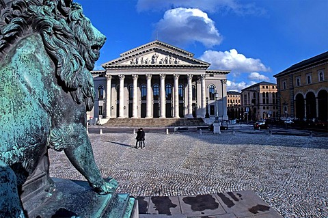 Lion statue and the Bavarian State Opera House, Munich, Upper Bavaria, Germany, Europe