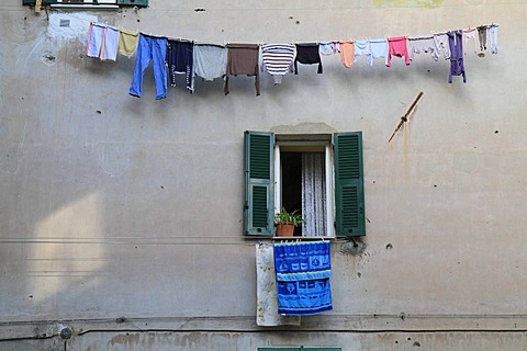 Laundry hanging to dry above an open window in the historic town centre of Ventimiglia, province of Imperia, Liguria region, Riviera dei Fiori, Mediterranean Sea, Italy, Europe