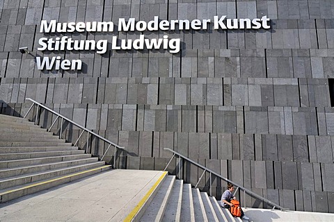 Man on stairs outside Museum Moderner Kunst, MUMOK, Museum of Modern Art building, MuseumsQuartier in Vienna, Austria, Europe