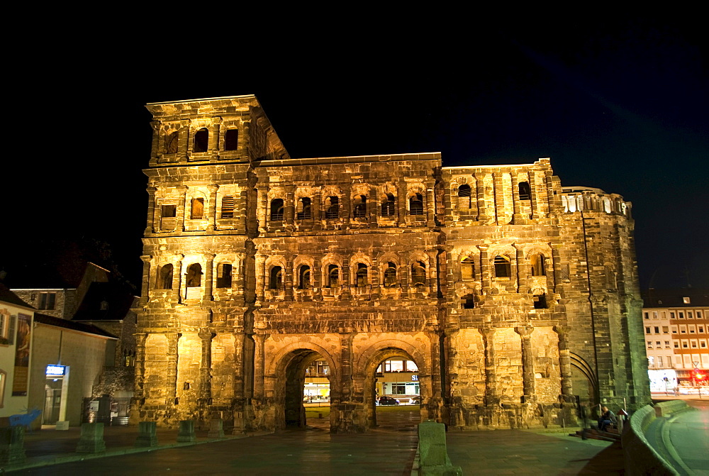 The back side of the Porta Nigra by night, the right part is the rest of a church, Trier, Rhineland-Palatinate, Germany, Europe