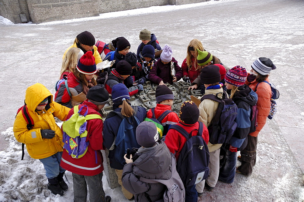 School class standing around a model of the historical city of Munich, Upper Bavaria, Bavaria, Germany, Europe