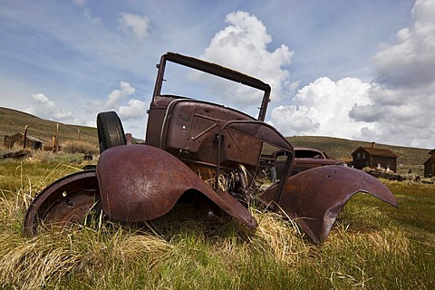 Vintage car, rusty old car wreck, Bodie State Park, ghost town, mining town, Sierra Nevada Range, Mono County, California, USA