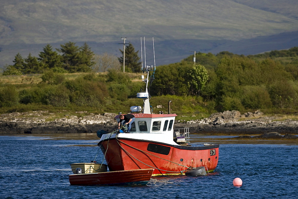 Fishing boat in the bay between the Isle of Mull and Ulva, Scotland, UK, Europe