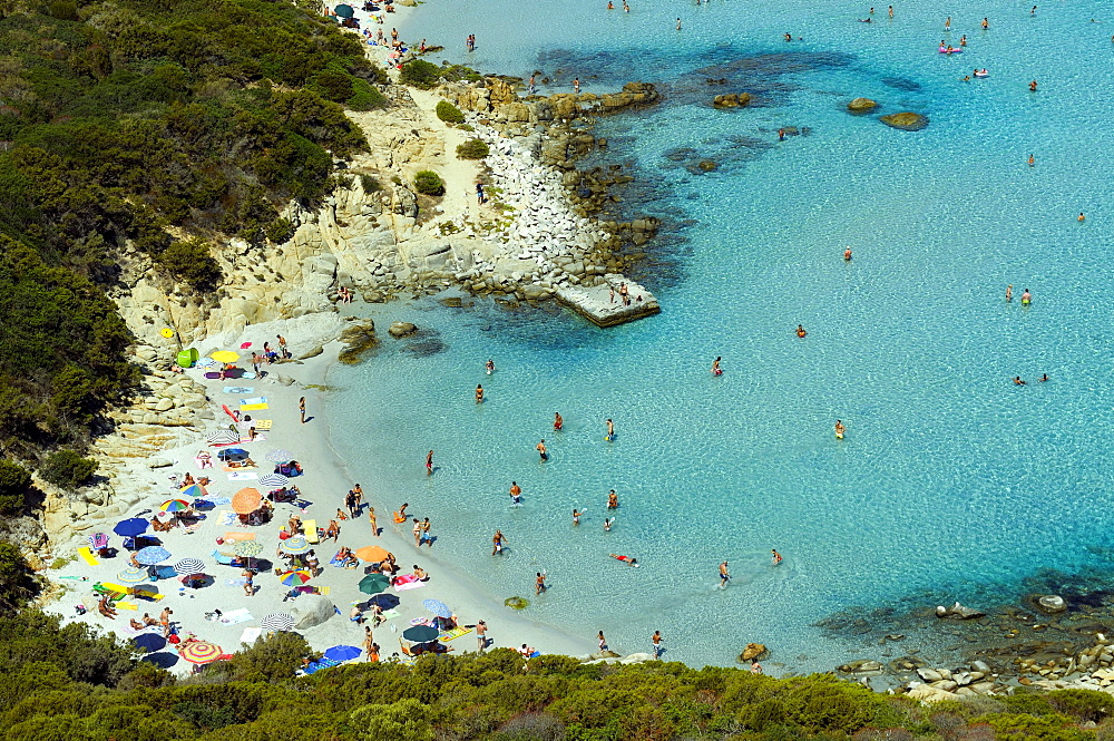 Bathing tourists and colorful parasols on the beach, crystal clear turquoise water, Cala Giunco, Porto Giunco, Capo Carbonara, Villasimius, Sardinia, Italy, Europe