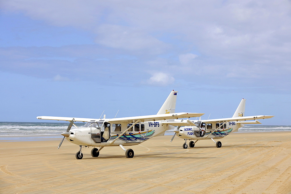 Aircraft on Seventy-Five Mile Beach, an official highway, the world's only official beach airport on a sand runway, UNESCO World Natural Heritage Site, Fraser Island, Great Sandy National Park, Queensland, Australia