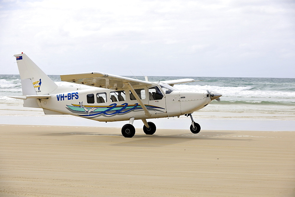 Aircraft taking off on Seventy-Five Mile Beach, an official highway, the world's only official beach airport on a sand runway, UNESCO World Natural Heritage Site, Fraser Island, Great Sandy National Park, Queensland, Australia