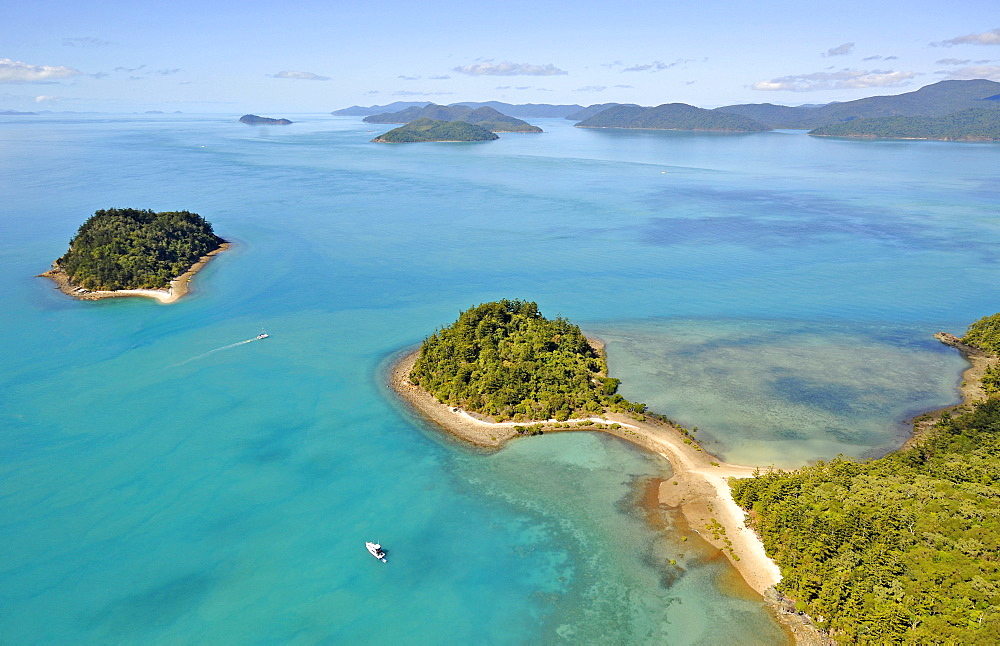 Aerial view of Pelican Island peninsula off Long Island, far left East Rock, Whitsunday Islands National Park, Queensland, Australia