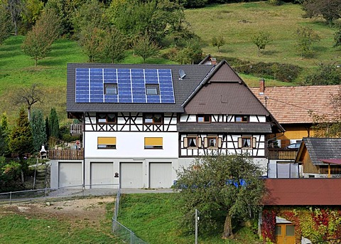 Solar panels on the roof of a house, farm, Gasthof Benz-Muehle inn, Ottenhoefen, Muehlenrundweg, Black Forest, Baden-Wuerttemberg, Germany, Europe