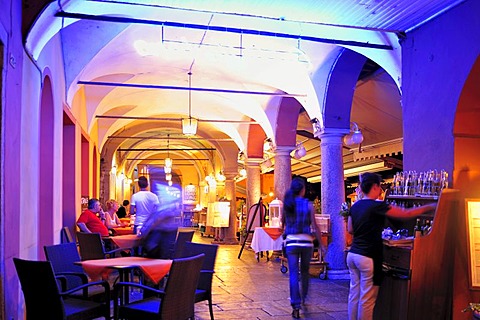 Arcades along the promenade with street restaurants, Lago Maggiore, Cannobio, Piedmont, Italy, Europe