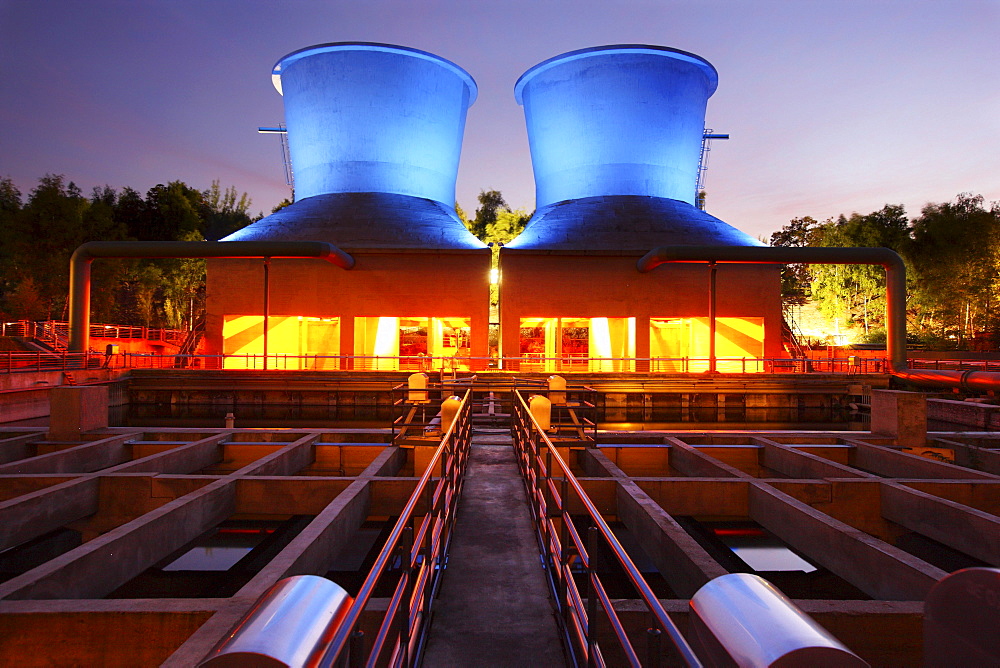 Illuminated cooling towers, water park in Westpark Industrial Park at Centennial Hall, Bochum, North Rhine-Westphalia, Germany, Europe