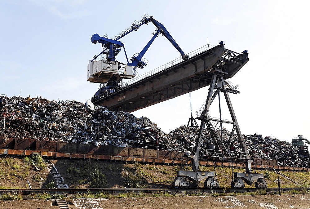 Large overhead crane handling scrap metal for recycling, scrap island, DuisPort inland port, Duisburg-Ruhrort, North Rhine-Westphalia, Germany, Europe