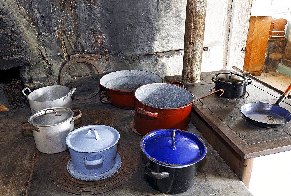 Pots on an old wood stove, kitchen in the Haus Andrinet house from 1740, Wolfegg farmhouse museum, Allgaeu region, Upper Swabia, Baden-Wuerttemberg, Germany, Europe