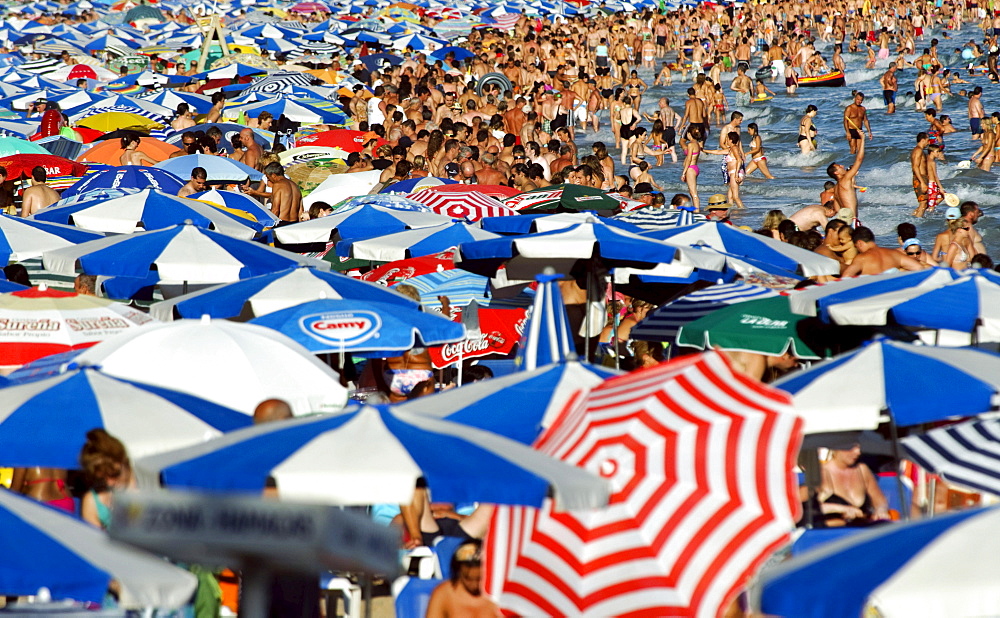 Tourists crowding Benidorm's Playa Levante beach during the main tourist season, Costa Blanca, Spain, Europe