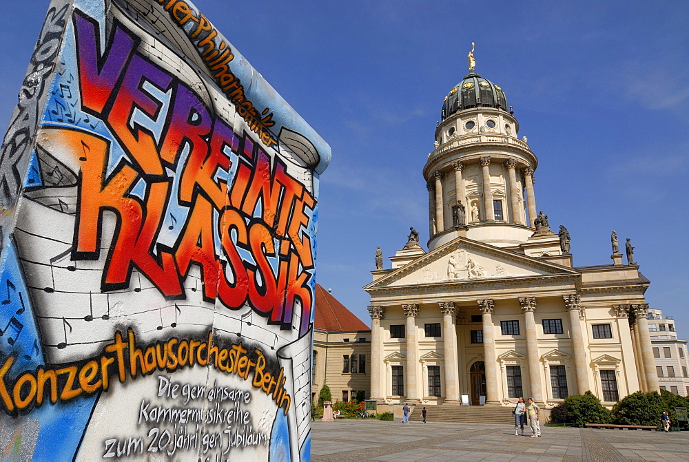 Graffiti as advertising on a piece of the Berlin Wall, French Cathedral, Gendarmenmarkt, Berlin, Germany, Europe